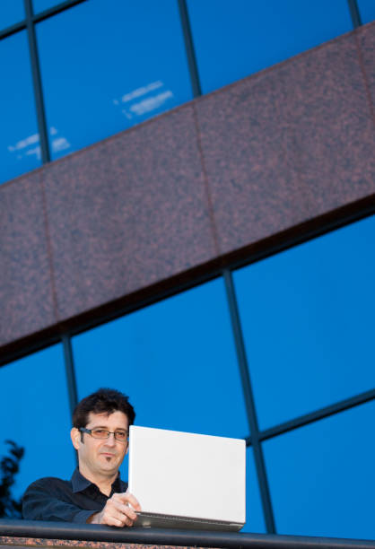 istock Man on the go with laptop 157505445