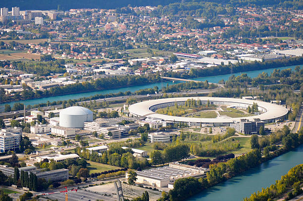 Syncrotron Industrial and technology area. Areal view of Grenoble's polygon scientifique, syncrotron ring and nuclear reactor. isere river stock pictures, royalty-free photos & images