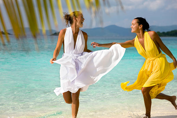 istock women wearing beach wedding dresses 157505834
