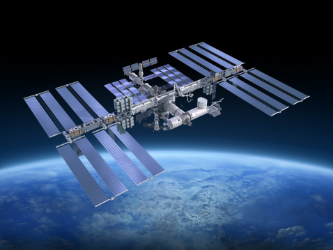 Hovering satellite on a black background with a copy space for a space topics and designs.3D rendered satelite on a black background. Satellite levitating in an outer space