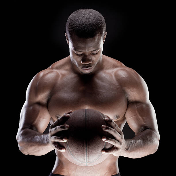 мышца человека с баскетбол - sensuality men shirtless studio shot стоковые фото и изображения