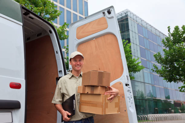 istock delivery boy standing next to his van 157506375