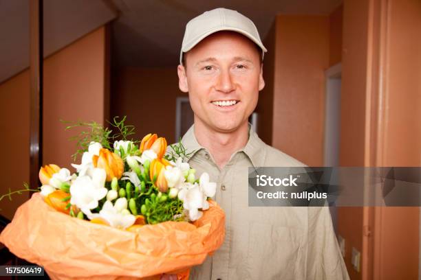 Delivery Boy With Flowers At Your Door Stock Photo - Download Image Now - Delivering, Flower, Valentine's Day - Holiday