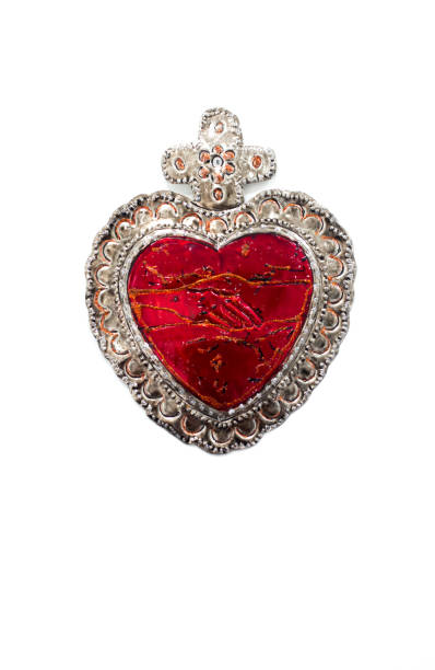 Red Tin Milagros Heart on White Background
