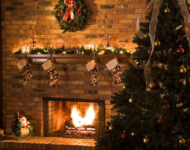 istock cozy Christmas fireplace scene with roaring fire 157506558