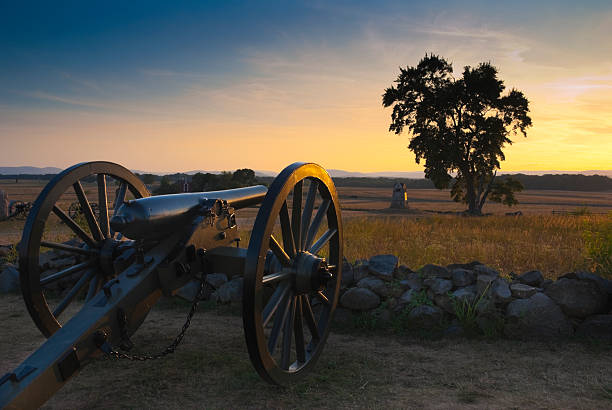 Gettysburg Sunset A cannon at the Gettysburg Battlefield at sunset. Picture taken at the "High Water Mark." gettysburg national military park stock pictures, royalty-free photos & images