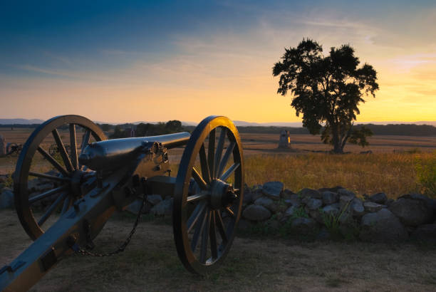 Gettysburg Sunset A cannon at the Gettysburg Battlefield at sunset. Picture taken at the "High Water Mark." gettysburg battlefield cannon stock pictures, royalty-free photos & images