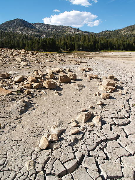 Dry Lake Bed Dry lake bed during drought in the Sierra Nevada mountains. lake bed stock pictures, royalty-free photos & images