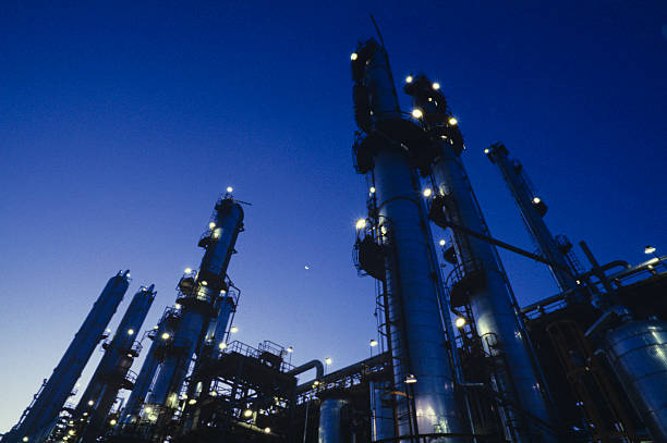 Highlighting the lights on a refinery at night stock photo