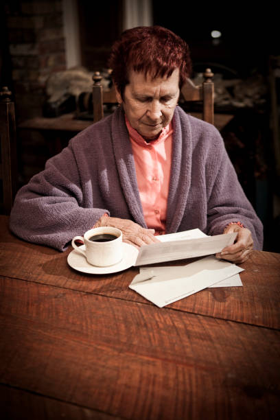 istock Distressed Senior Woman with Bills 157507814