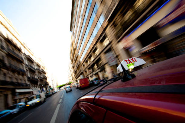 Taxi driving through a street in Barcelona, Spain on October 3, 2021