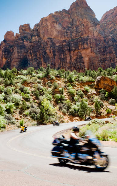 istock Biker riding through Zion National Park 157507920