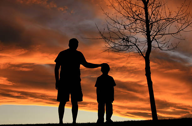 istock Caucasian Father and Son Bonding Silhouette 157507951