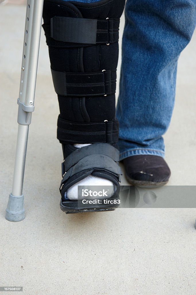 Mature man on crutches 55-59 Years Stock Photo
