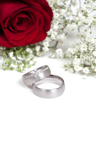 istock wedding ring, red rose and gypsohila 157508617