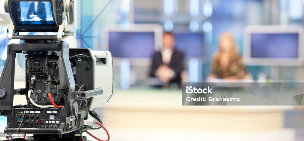 Two newsreader in front of television camera Television Set Stock Photo Two newsreader in front of television camera Television Set Stock Photo