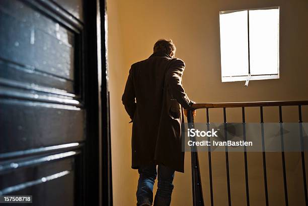 Man Leaves Home And Goes Downstairs Stock Photo - Download Image Now - Men, Leaving, Disembarking