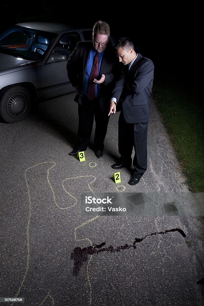 Detectives Picture of two detectives at a crime scene.   30-34 Years Stock Photo