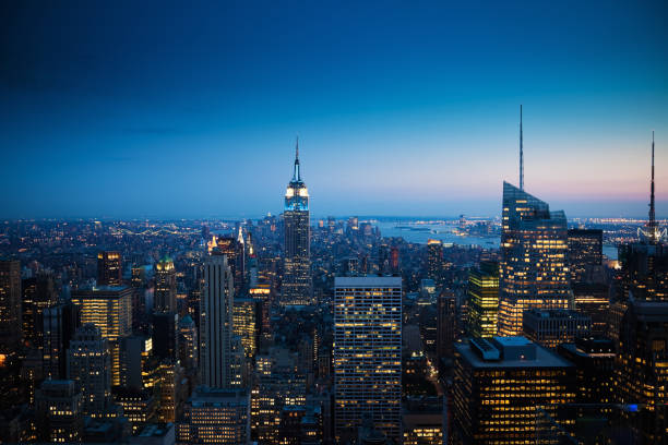 Sunset over the illuminated Manhattan Downtown district. New York City, USA. 