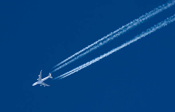 istock Airplane Leaving Contrail 157508850