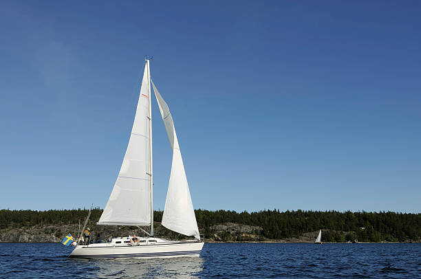 istock Sailing in the archipelago, Swedish national flag 157508982