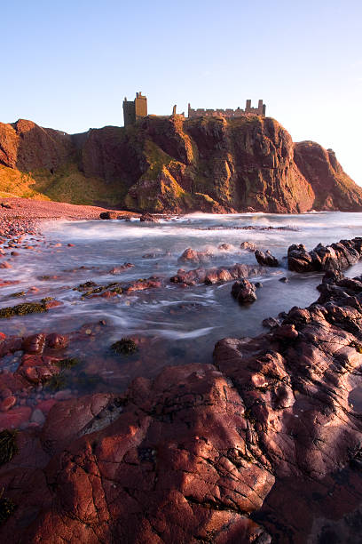 Spectacular Dunnottar Castle, Aberdeenshire. Dunnottar Castle at Dawn. aberdeen scotland stock pictures, royalty-free photos & images