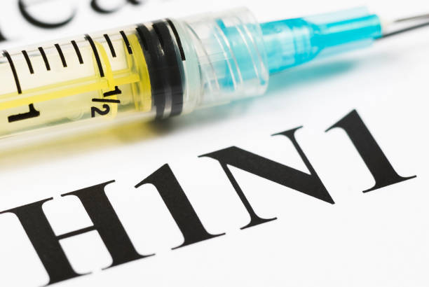 istock H1N1 Flu Shot, Vaccination close-up (cyan syringe) - II 157509118