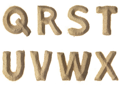 Q-R-S-T-U-V-W-X alphabet sand letters.