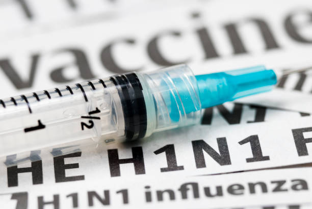 istock H1N1 Flu Shot, Vaccination headlines (cyan syringe) - I 157509199