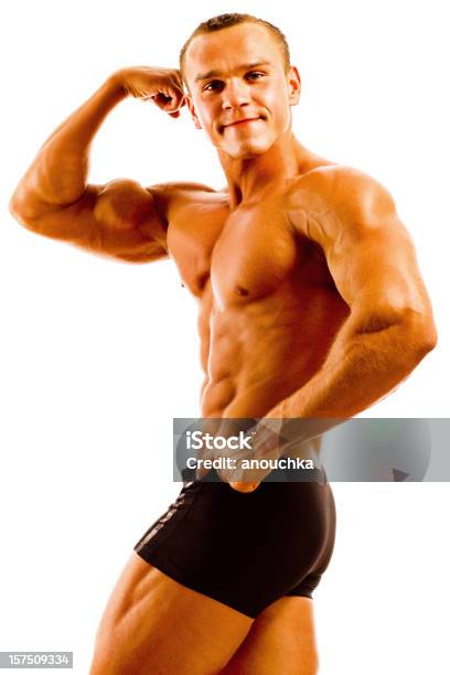 Body Builder Posing On White Background Stock Photo - Download Image Now - Body Building, Shirtless, 20-24 Years