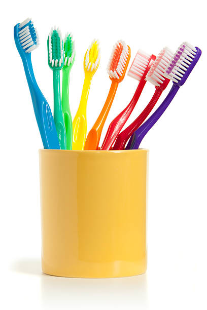 escovas de dente isolada no branco - toothbrush plastic multi colored hygiene - fotografias e filmes do acervo