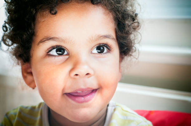 istock Smiling child with high contrast lighting 157509465
