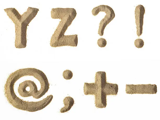 YZ?!@;+- alphabet sand letters.