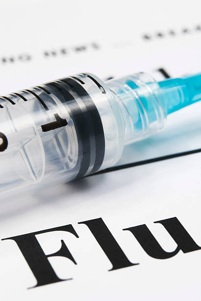 istock Flu health issue concept (cyan syringe close-up) - I 157509519