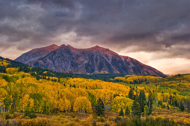 istock Sunrise and Storm Clouds over Autumn Mountain 157509542
