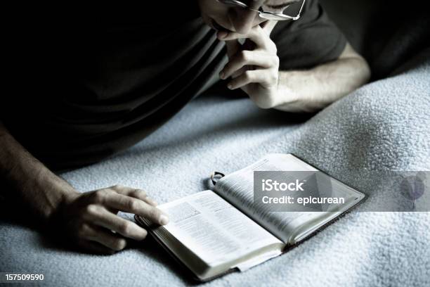 Reading The Bible Stock Photo - Download Image Now - 20-29 Years, Adult, Adults Only