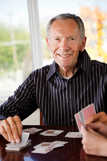 istock Senior Citizen Man Playing Cards 157509613