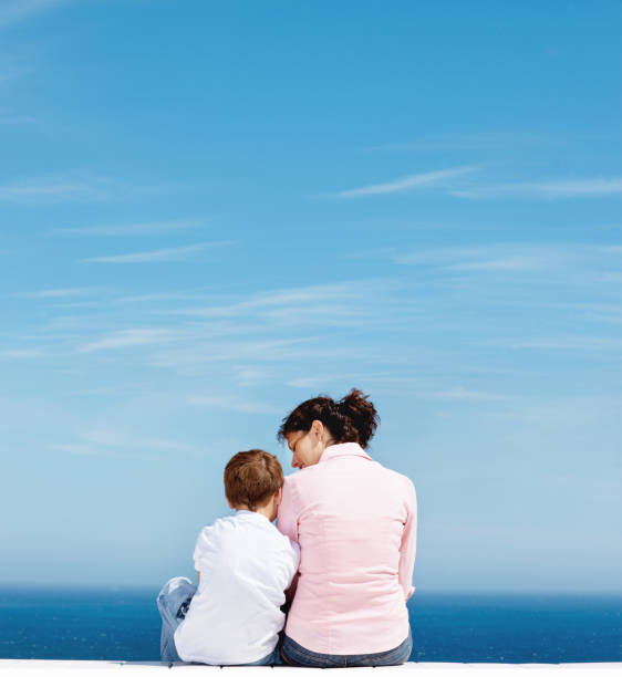 istock Mother and son cuddling, enjoying the view 157509690