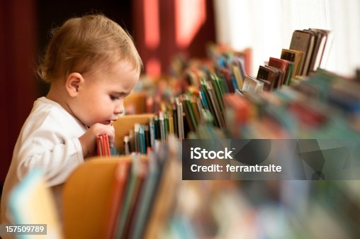istock Little girl in library 157509789