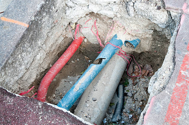 Damaged Pipe A public utility pipe needing repair work. telephone line stock pictures, royalty-free photos & images
