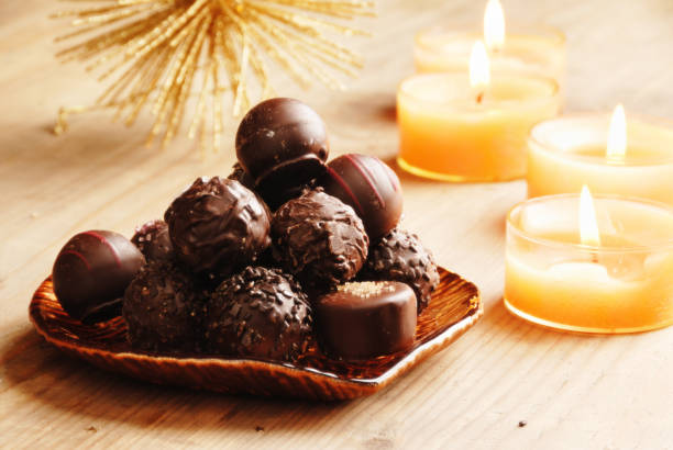istock christmas chocolate truffles and candles 157510064