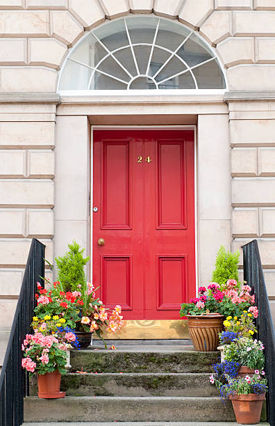 Edinburgh Door Entrance Flowers decorating a shared entrance to flats / apartments in Edinburgh's New Town doorstep stock pictures, royalty-free photos & images