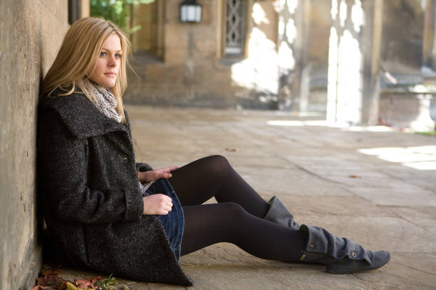 istock woman sitting on floor 157510163