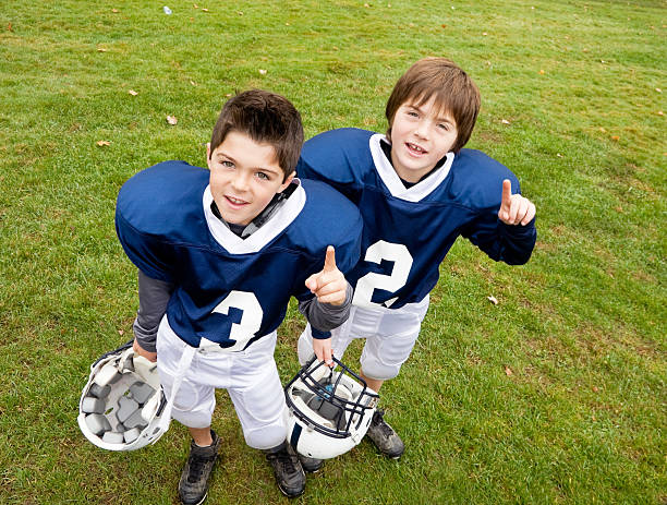 young boys football players. we're number one stock photo