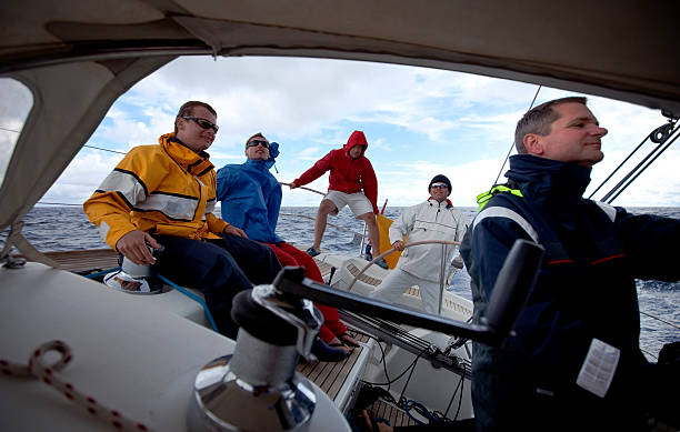 istock Happy sailing crew on sailboat 157510216