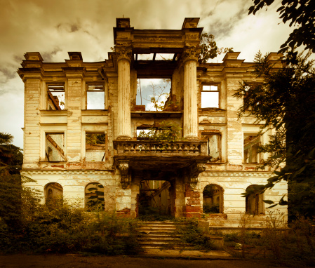 Abandoned old style palace in Abkhazia. Slight toned in sepia and vignetting effect, retro style. 