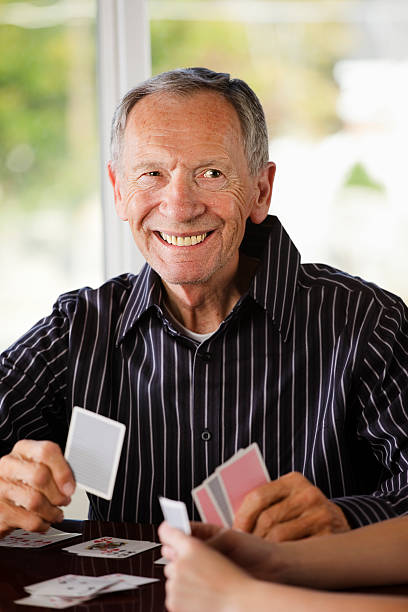 istock Senior Citizen Man Playing Cards 157510294