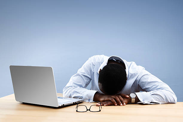 istock Over worked businessman sleeping at his desk 157510450