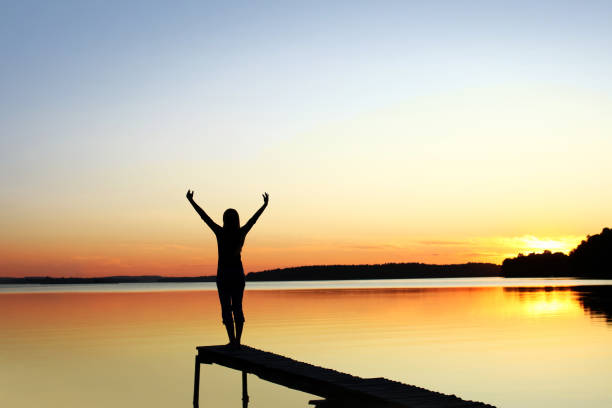 Woman's Silhouette on a Beautiful Nature Scene stock photo