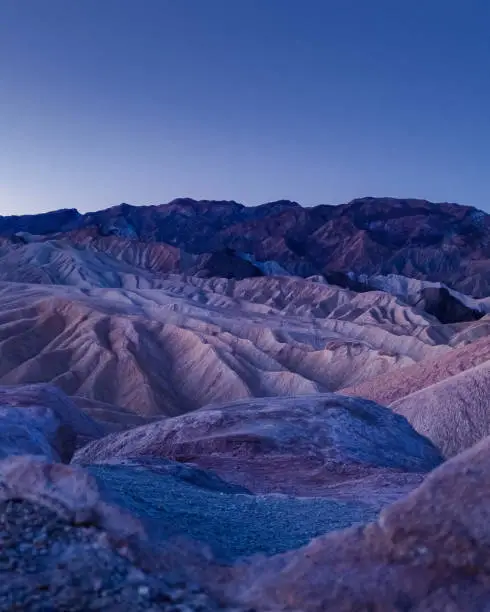 Zabriskie Point landscape at blue hour, just before sunrise at twilight. Death Valley National Park, California.